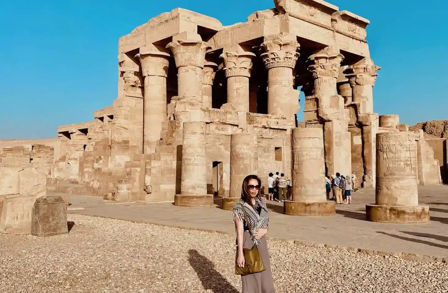 egypt travel guide for solo travelers A-wonderful-picture-of-a-woman-in-front-of-the-Temple-of-Kombu