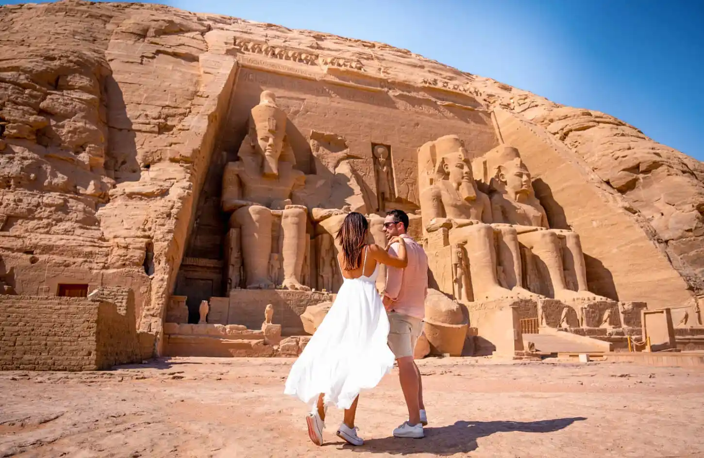 How to Travel Safely in Egypt a-photo-of-a-couple-in-front-of-abu-simbel-temple-in-aswan