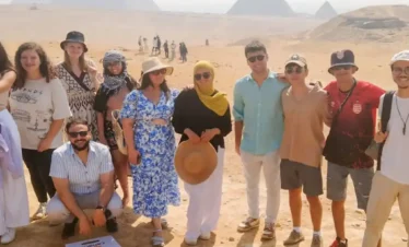 7-Day Cairo & Nile Cruise Tour by Flight A-wonderful-shot-of-one-of-our-wonderful-group-in-front-of-the-Giza-Pyramids.