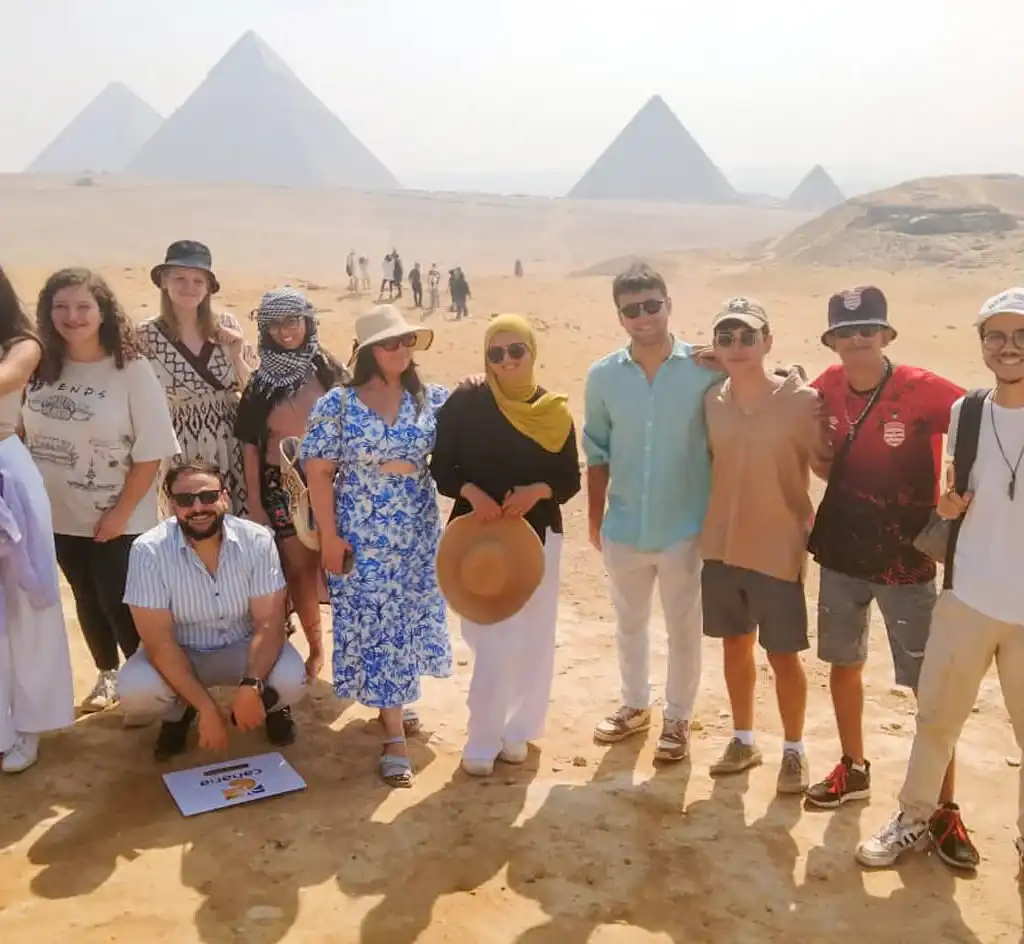 7-Day Cairo & Nile Cruise Tour by Flight A-wonderful-shot-of-one-of-our-wonderful-group-in-front-of-the-Giza-Pyramids.