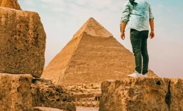 Tourist-man-standing-in-front-of-the-pyramid-of-Khafre Discover Cairo in 3 Days: Pyramids, Museums & Cultural Wonders