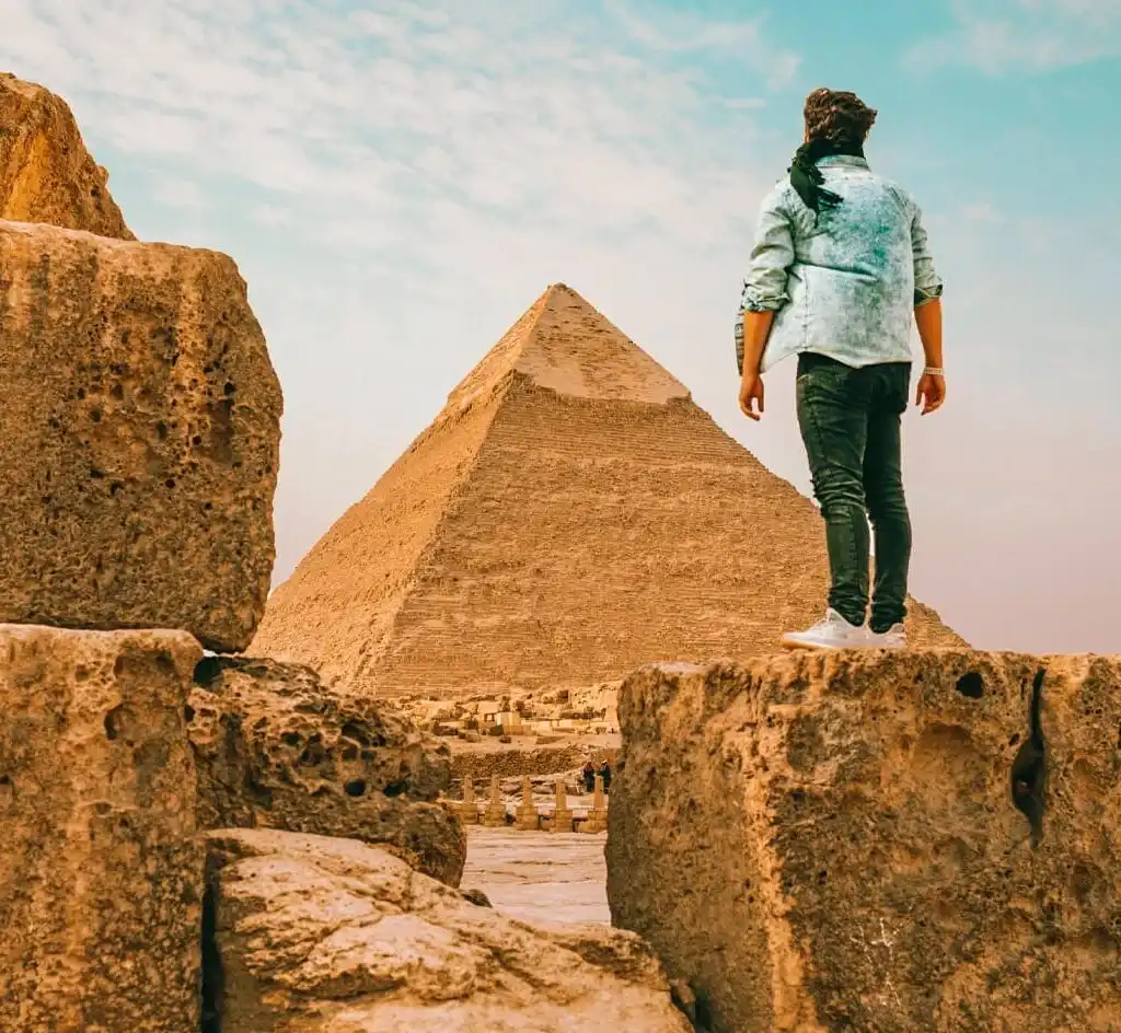 Tourist-man-standing-in-front-of-the-pyramid-of-Khafre Discover Cairo in 3 Days: Pyramids, Museums & Cultural Wonders