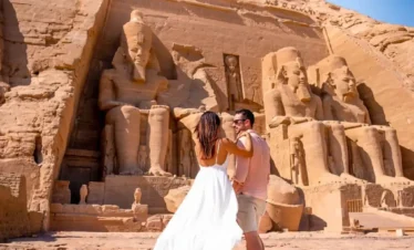 6 Days Cairo and Aswan with Abu Simbel Temple a-photo-of-a-couple-in-front-of-abu-simbel-temple-in-aswan