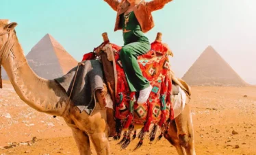 8-Day All-Inclusive Cairo & Nile Cruise Tour a-wonderful-shot-of-a-girl-on-the-camel-in-front-of-the-pyramids