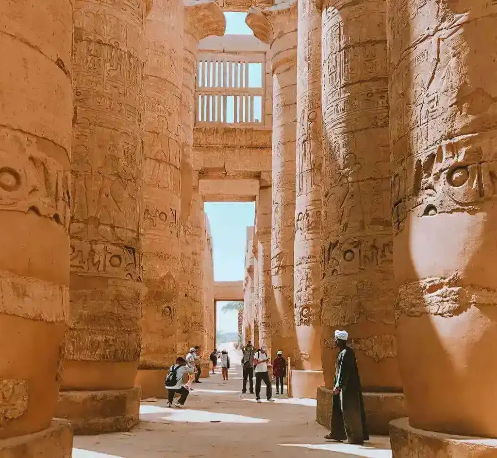Nile Cruises 2 Days Luxor City Tours From Hurghada A-picture-of-some-visitors-near-the-columnzs -of-Karnak-Temple. A-picture-of-some-visitors-near-the-columns-of-Karnak-Temple