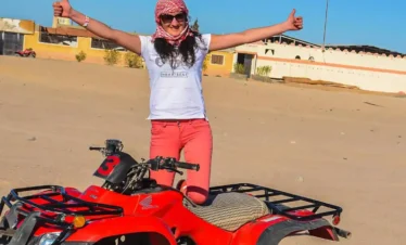 Quad Biking in Sharm El-Sheikh Desert A-wonderful-shot-of-a-girl-getting-ready-to-ride-a-quad-bike