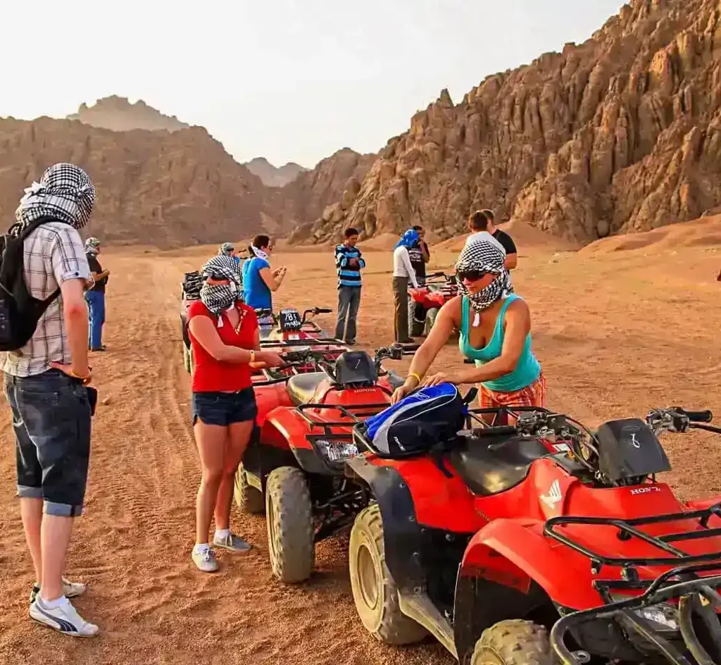 Quad Biking in Sharm El-Sheikh Desert A-wonderful-shot-of-a-group-of-people-preparing-to-ride-a-quad-bike-from-one-of-the-safari-trips-in-Hurghada