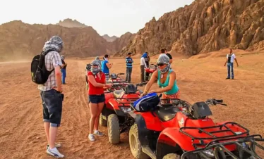 Quad Biking in Sharm El-Sheikh Desert A-wonderful-shot-of-a-group-of-people-preparing-to-ride-a-quad-bike-from-one-of-the-safari-trips-in-Hurghada
