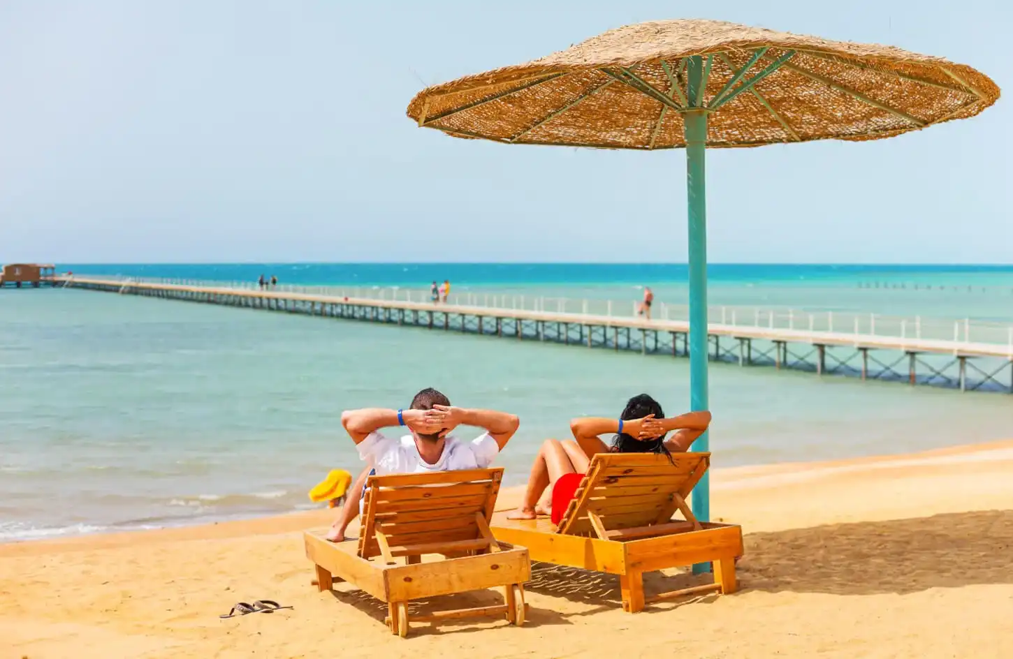 Trips from Hurghada to Cairo: The Complete Guide to Hurghada Excursions to Cairo (2026) A wonderful picture of a couple sitting on one of the beaches of the Red Sea