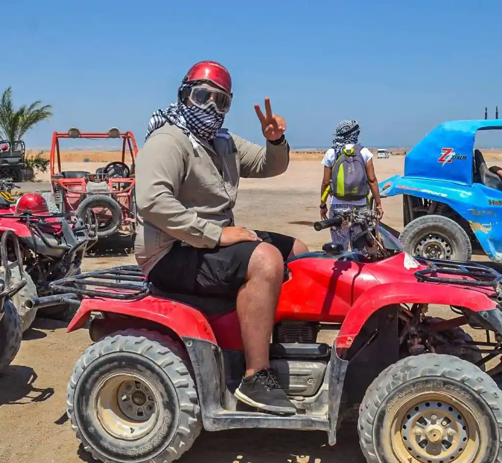 Book Your All inclusive vacation package — Egypt in One Epic Trip A-wonderful-shot-of-a-person-riding-a-quad-bike-from-one-of-the-safari-trips-in-Hurghada