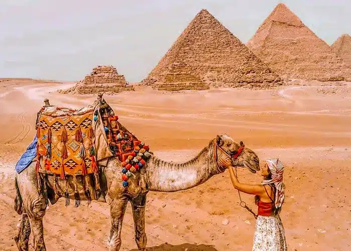 Book Your All inclusive vacation package — Egypt in One Epic Trip tourist girl with camel at giza pyramids
