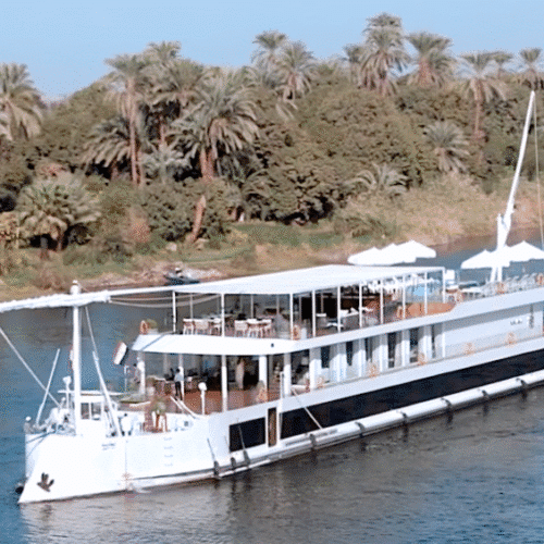 Nawara Dahabiya exterior sailing on the Nile River with traditional sails
